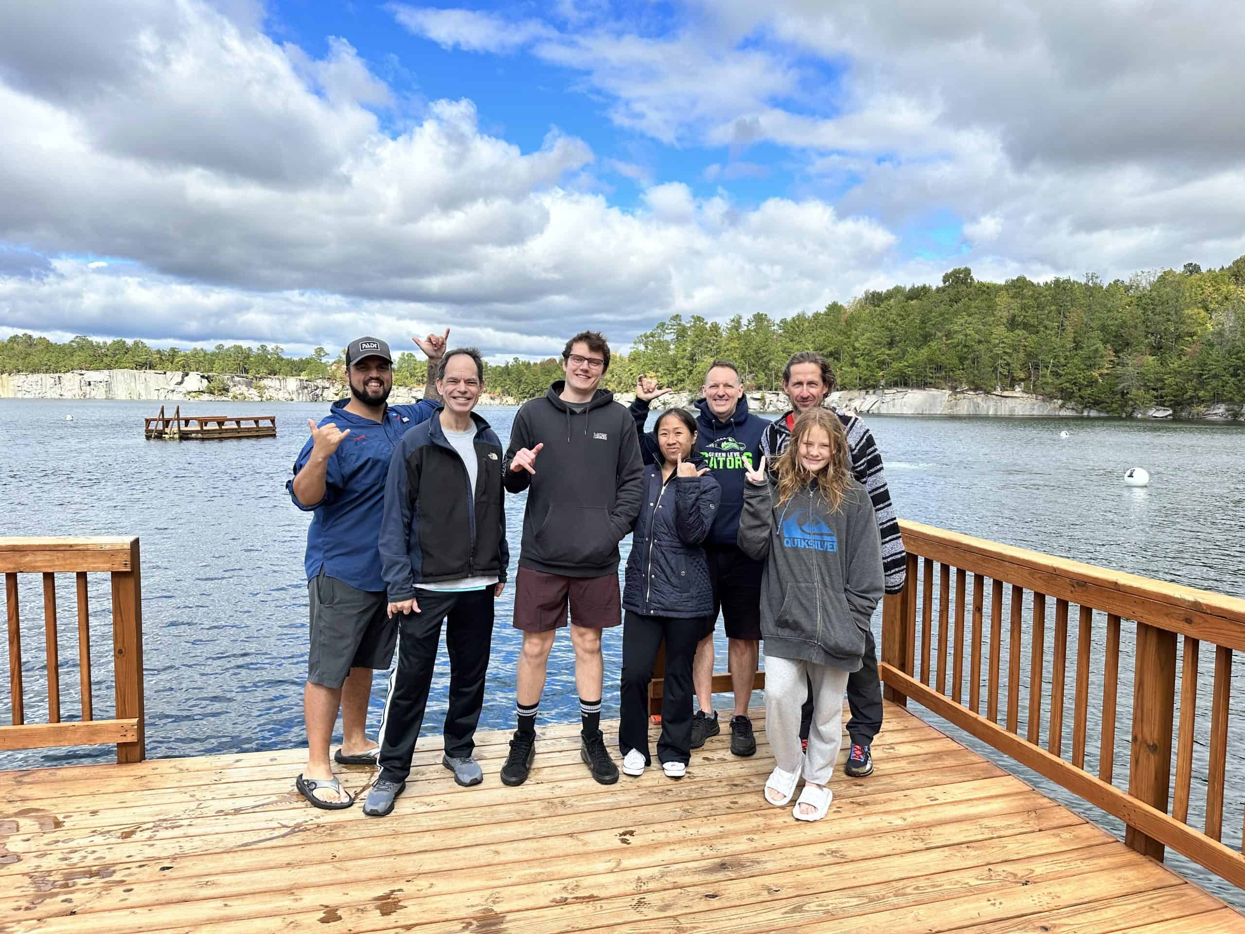 PADI Open Water Scuba Divers celebrating graduation with Thomas Hughes as the instructor PADI Open Water Scuba Divers celebrating graduation with Thomas Hughes as the instructor