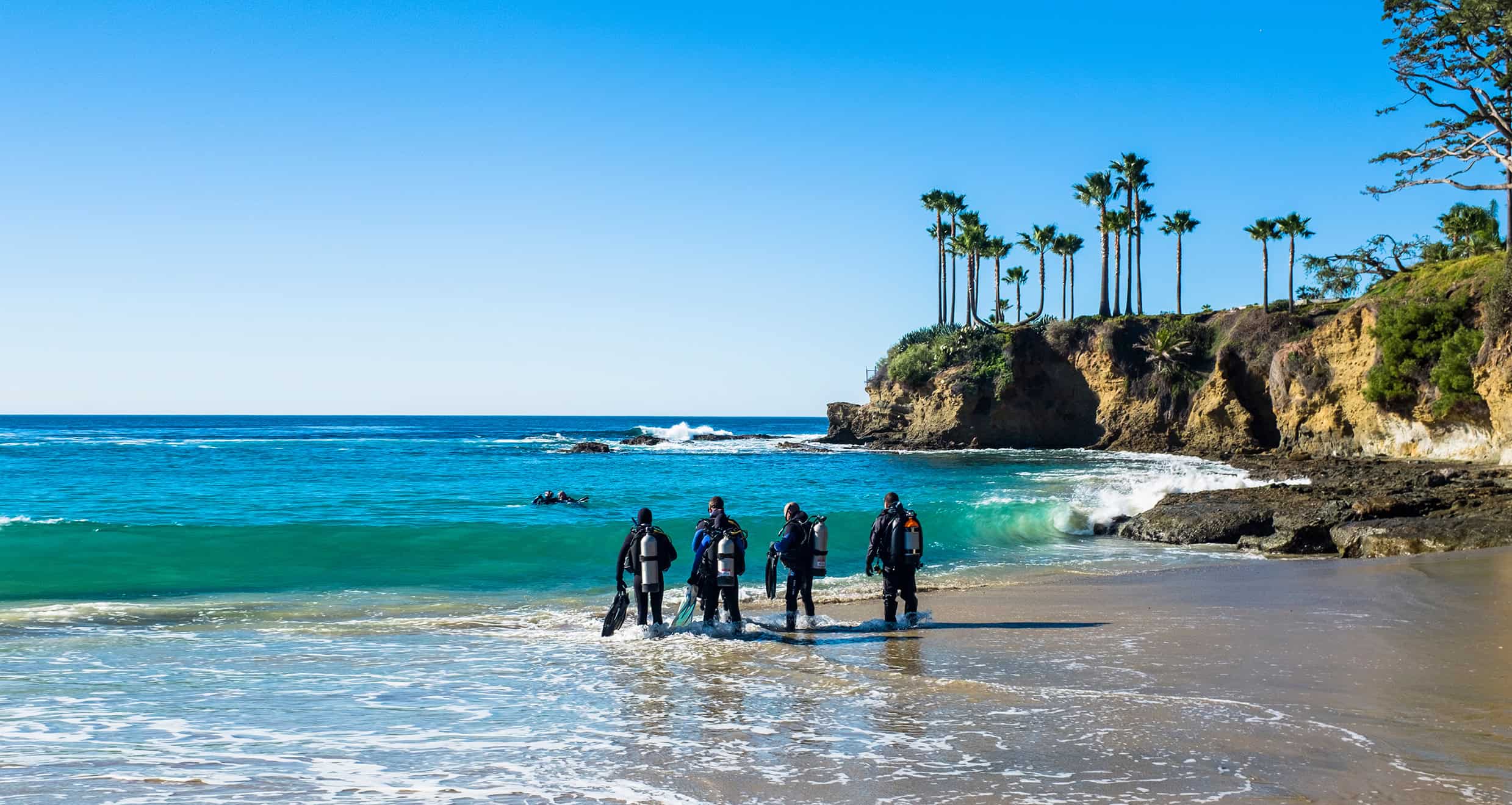 Scuba Divers doing shore entry on beach
